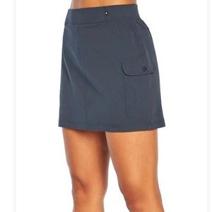 Marika India ink blue skirt small athletic with snap pockets. NWT.